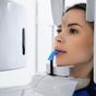 Patient undergoing a cone beam CT scan for 3D implant planning