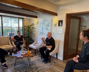 Dr. Janette meeting with patients in the consultation room