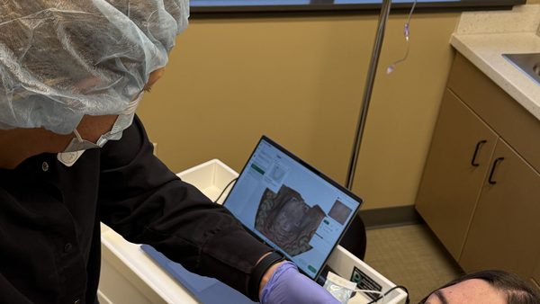 Intraoral scanner capturing a digital impression for implant planning