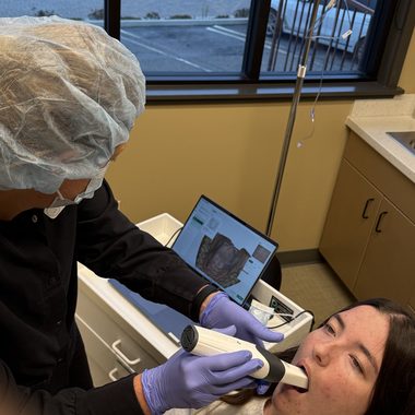 Intraoral scanner capturing a digital impression for implant planning